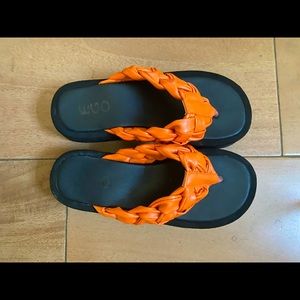 Morocco Braided Thong Strap Chunky Sole Flat Sandal In Orange Faux Leather